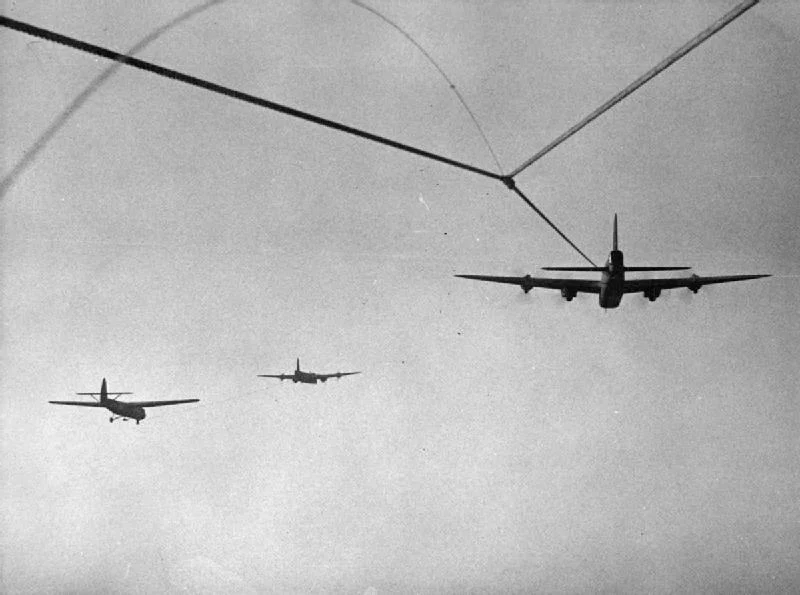 Archival footage of WWII gliders in tow, upscaled